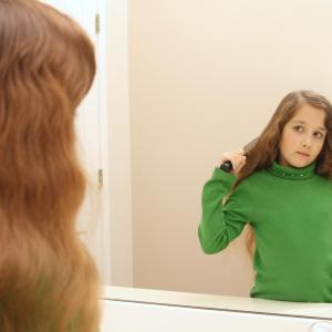 Childhood abuse delays maturation specific to emotion circuits in girls