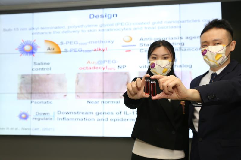 Ms Alisa Han (PhD student, left) and Prof Jonathan Choi (right) display the gold nanoparticle mixed with saline